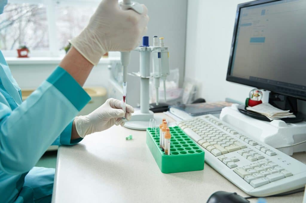 Female laborant working with blood tests in hospital